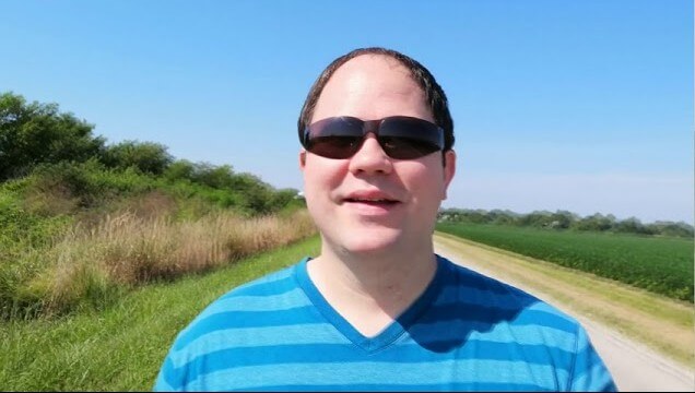 Pastor Chris preaching outside